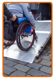 A wheelchair on a ramp going into a vehicle