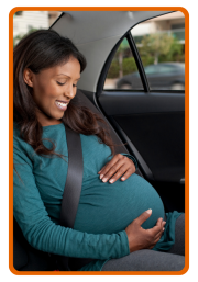 Pregnant woman riding in car